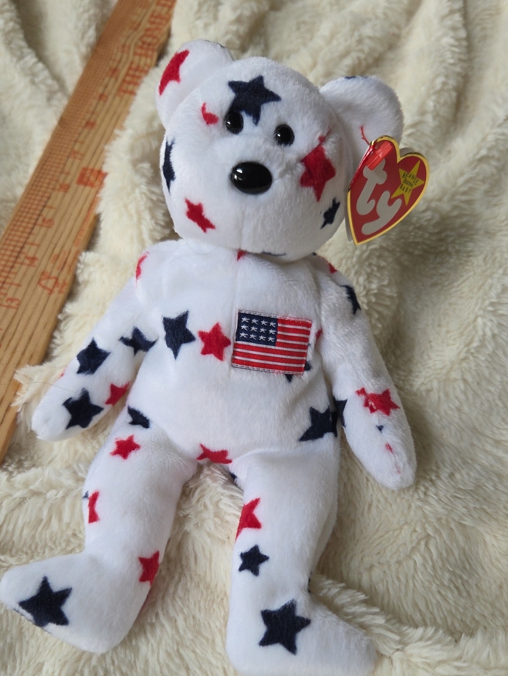 Glory the Bear" (UPC 008421041886), a patriotic white Ty Beanie Baby covered in